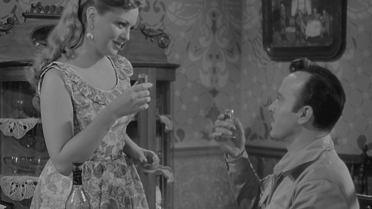 La Vida No Vale Nada backdrop