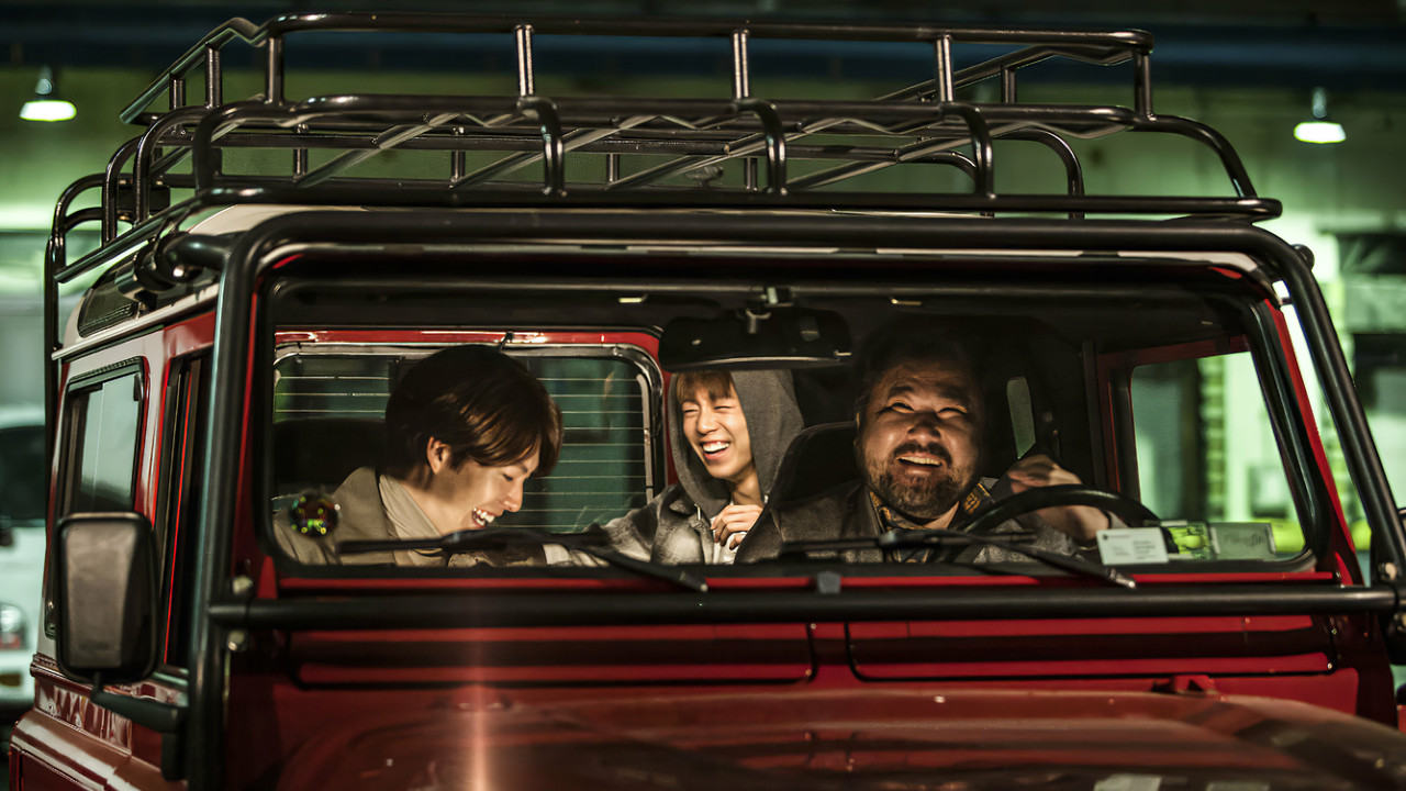 The Con Artists backdrop