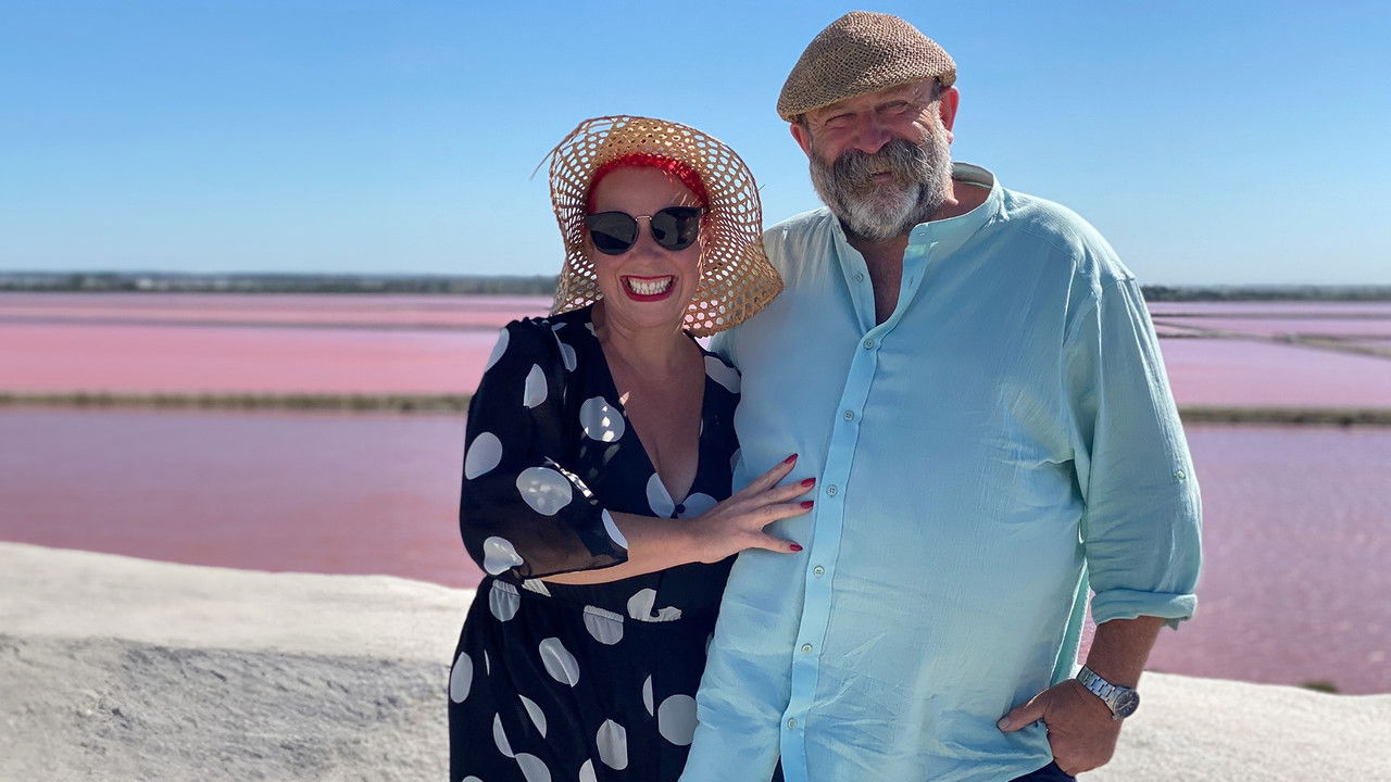 Secret France with Dick and Angel backdrop