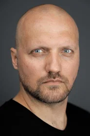Photo of Viktor Kuzin as Olga’s security guard