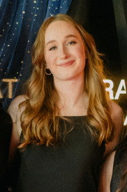 Photo of Emily Helms as Lucy (voice)
