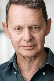 Photo of Jonathan Oliver as The Scientist (voice)