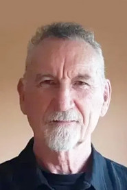 Photo of Bruce McFee as Prison Sign-In Guard