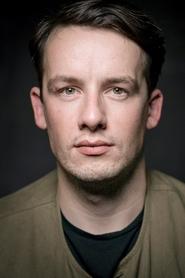 Photo of Matthew Seadon-Young as Ruskin / Johnson / Decker