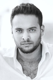 Photo of Austin Dan as Rakesh