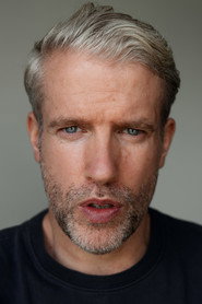 Photo of Liam Reilly as Russ