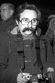 Photo of Georges Azenstarck as Photographer (segment "La semaine sanglante")