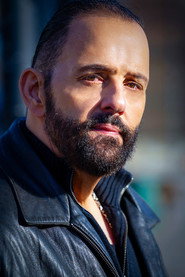 Photo of George Zouvelos as Lt. Adam Galanis
