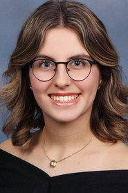Photo of Kamly Shaheen as Newscaster