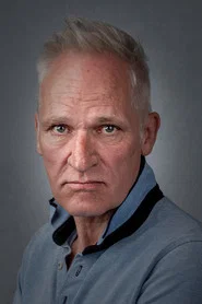 Photo of Bastian Howard as Classy Executive
