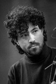 Photo of Adam Paroussos as Robin