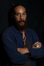 Photo of Justin Warfield as Reggie