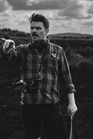 Photo of Paudie Baggott as News Reporter (as Paudie Baggott)