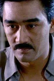 Photo of Michael Dinga as Senior Tax Inspector Lam
