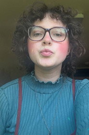 Photo of Ainsley Feeney as Ainsley, Debate Moderator