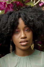 Photo of Denai Moore as Self - Guitar, Vocals