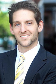 Photo of Justin Xavier Smith as Sid Baker
