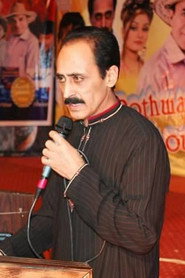 Photo of Anjum Malik as Shahid / Shedu