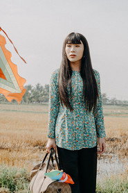 Photo of Lê Minh Dũng as Hồng Hoa/Hùng