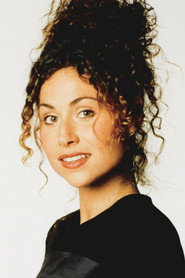 Photo of Minnie Driver as Director Janet Harward