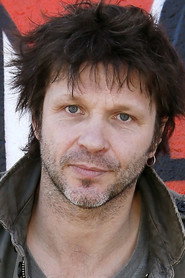 Photo of Bertrand Cantat as Self - 1999 concert (archive footage)