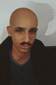 Photo of Gabriel Faria as Maduro/Reporter voice