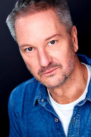 Photo of J. Tucker Smith as Tom Travis