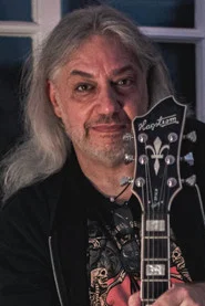 Photo of Manni Schmidt as Guitars, Backing Vocals