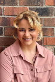 Photo of Jenni Di Fatta as Nurse Helen White