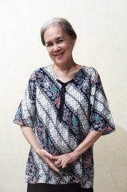 Photo of Tina Roostiati as Yangti (Ibu Diana)