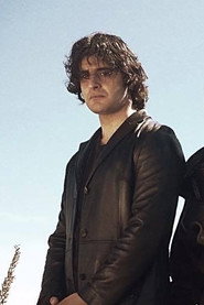Photo of Noah Robbie as Rogan