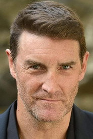 Photo of Patrick Boll as Father Isabelle