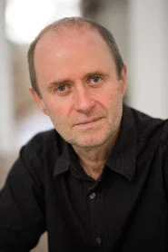 Photo of Patrick Brennan as Aaron