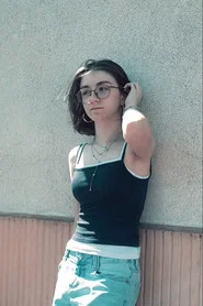 Photo of Emmie Palisse as Iris Lambert