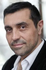 Photo of Eric da Costa as Hockey coach