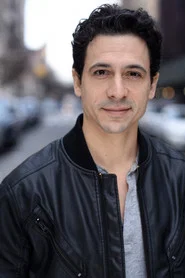 Photo of Joe Feldman-Barros as Clerk (voice)