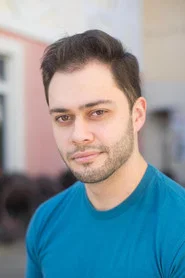 Photo of Julian Simoes as Ethan / Camp Counselor