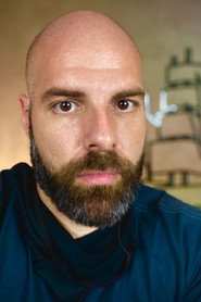 Photo of João Tessari as Carlos Monteiro