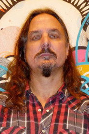 Photo of Thomas R. Peters Jr. as Beat book shop proprietor