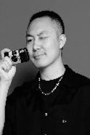 Photo of Xiaoliang Song as Cai Laoban
