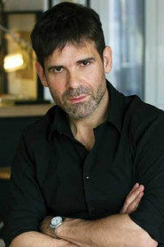 Photo of Menelaos Karamaghiolis as narrator