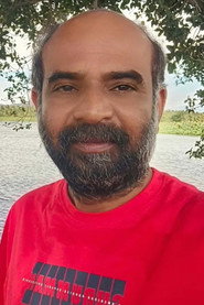 Photo of Pragatheeswaran as Raji`s Father