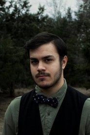 Photo of Caedmon Falls as Rick Corrino