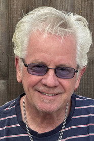 Photo of Johnny Colla as Self - Guitars, Saxophone, Percussion, Vocals