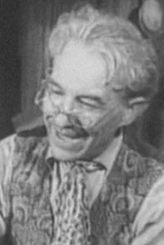 Photo of Georgiy Uvarov as Husband of Woman in the Market Place