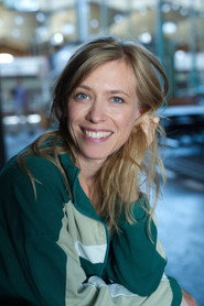 Photo of Kirstin Warnke as Lucy Komisar