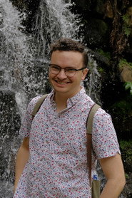 Photo of Brandon Carter as Pet Shop Attendant