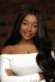 Photo of Tade Adebajo as Carly