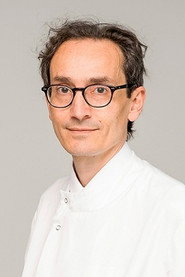 Photo of Tom Solomon as Neurologist Professor