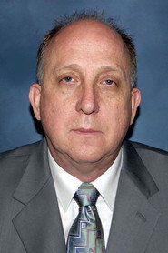 Photo of Max Phipps as Mr Baker QC